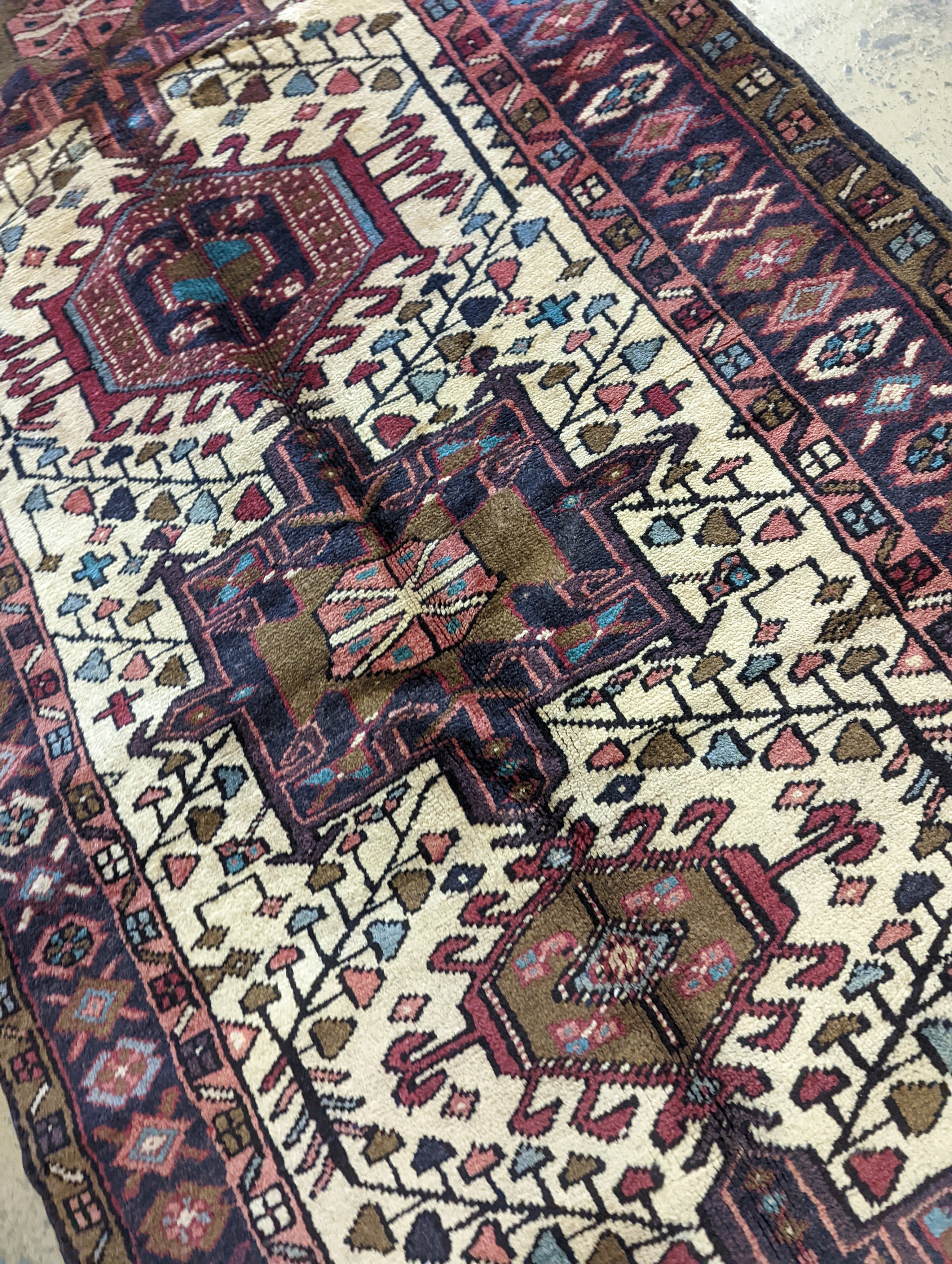 A Karajeh hall carpet, 320 x 106cm